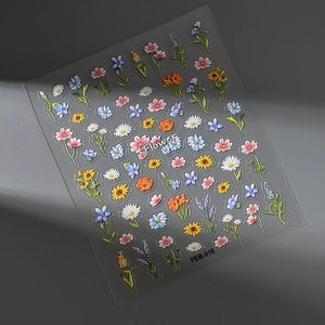 Macro view of 3D embossed floral nail stickers featuring sunflowers and daisies FEB-918