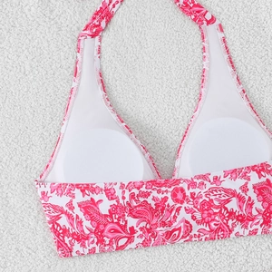 Detail of bikini top with pink paisley print, breathable lining and removable pads