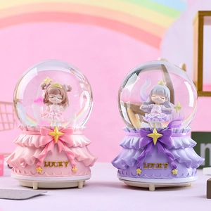 Pink and purple snow globe music boxes with cartoon girls and Lucky engraving