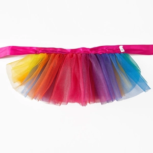 Close-up of rainbow tutu dog skirt with multi-layer mesh and pink satin ribbon tie