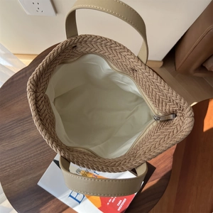 Top view of khaki woven tote bag showing large capacity inner lining and zipper closure