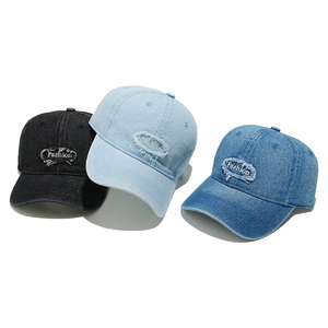 Three distressed denim baseball caps with Fashion embroidery in black and blue tones