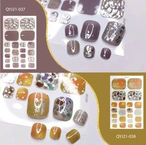 Detail of waterproof toenail stickers in purple and yellow with foil and glitter accents