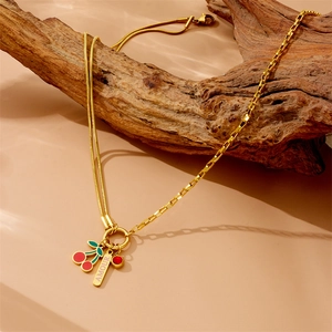 Gold cherry necklace with AMOUR plaque and red stone pendant on unique mixed chain