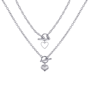 Detail of silver heart pendants and toggle clasp on elegant chain necklaces