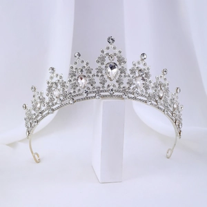 Detailed view of silver bridal crown with teardrop rhinestones and pavé crystal setting
