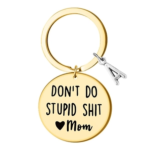 Detailed shot of golden stainless steel keychain with Mom engraving and letter A charm