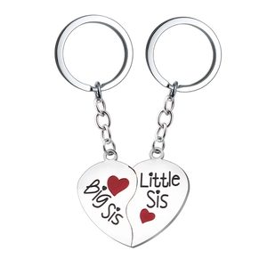 Silver heart keychain with Big Sis and Little Sis engraving and red heart detail