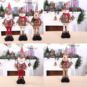 Close-up of telescopic Christmas plush toys featuring Santa, Snowman and Reindeer characters