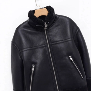 Black leather aviator jacket with warm shearling collar and zipper detail in a flat lay view