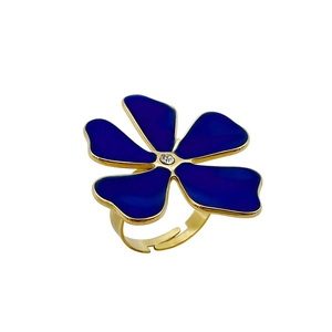 Vintage gold-plated flower ring with blue enamel petals and sparkling center stone