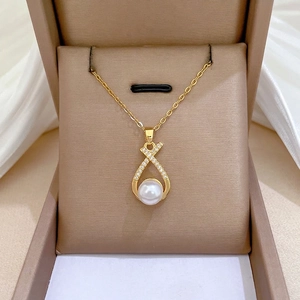 Titanium steel jewelry set featuring a diamond cross pearl necklace in a gift box display