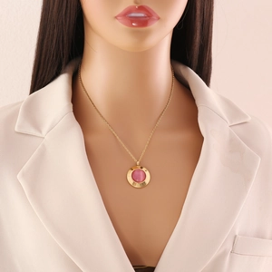 Retro stainless steel necklace with round pink opal pendant worn on elegant gold chain