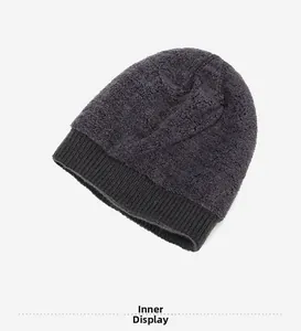 Detail of warm grey knit beanie showing the thick faux shearling fleece lining for winter
