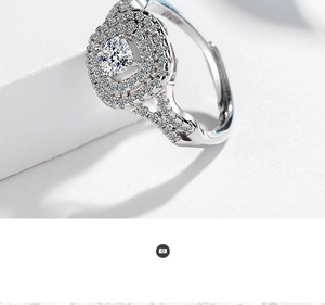 Close-up of sparkling double-row pavé diamond ring with a large center zircon on white stone