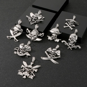 Detailed close-up of pirate skull silver pendants with punk rock style and naval elements