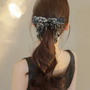 Elegant ink floral bow hair clip for women with black and white vintage print