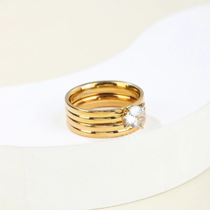Three-piece layered gold-plated titanium steel ring set with a large round zircon stone