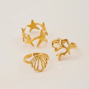 Three-piece gold ocean themed adjustable rings set featuring starfish and seashell designs