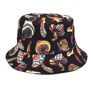 Close-up of colorful mushroom patterns on a black canvas bucket hat with detailed stitching