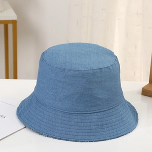 Detailed macro shot of blue denim bucket hat texture and durable cotton fabric weave