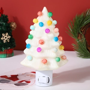 Detail of vintage ceramic Christmas tree night light with colorful beads and manual switch