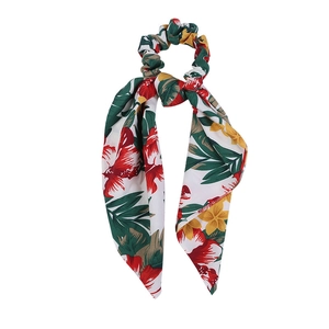 White floral scrunchie hair tie with long ribbon tail and tropical flower pattern