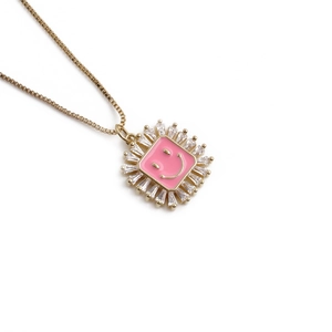 Golden necklace with pink enamel square smiley face pendant and sparkling zircon accents