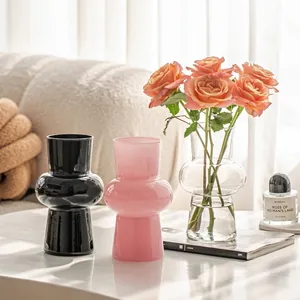 Three-piece geometric glass vase set in black, pink, and clear for stylish home decor