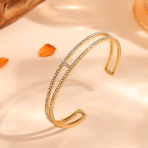 Bracelet jonc élégant en acier titane doré avec incrustation de cristaux brillants