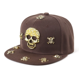 Fashionable dark brown hip hop snapback hat featuring golden skull rivets and flat brim