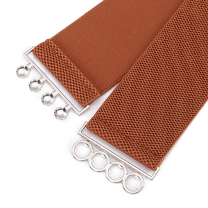 Brown elastic wide belt for women with a silver metal buckle on a white background