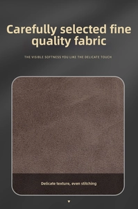 Detailed view of high-quality dark brown suede texture with symmetrical stitching lines