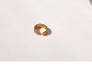 Detailed close-up of golden three-layer bamboo texture adjustable open ring for women