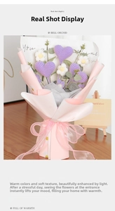 Handmade crochet bouquet with purple hearts and daisies in pink gift wrapping