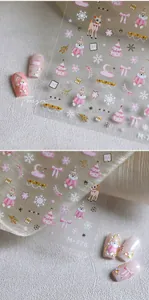 Detail showing 3D embossed pink Christmas bear and snowflake nail art stickers