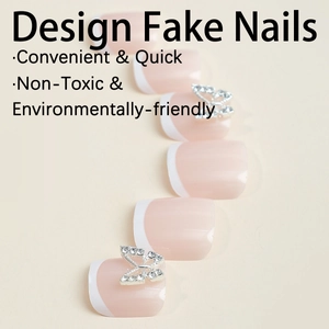 Short French white tip press-on toenails with silver butterfly rhinestone accents