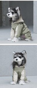 Detail of waterproof pet raincoat with built-in harness and adjustable hood design
