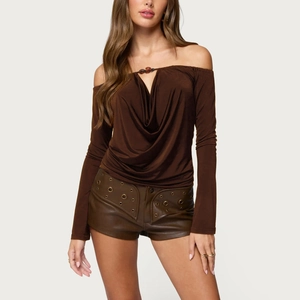 Detail view of brown off-shoulder long sleeve top with beaded cowl neck and ruched design