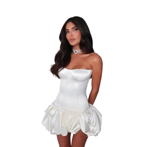 Detail of white strapless satin mini dress featuring a fitted bodice and pleated bubble hem