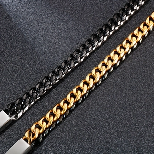 Detail of high-polish double layer Cuban link chains in gold and black stainless steel