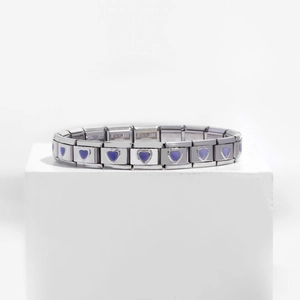 Macro detail of 9mm stainless steel modular charm link with a purple enamel heart design