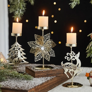 Golden Christmas metal reindeer and snowflake candle holders for festive table decor