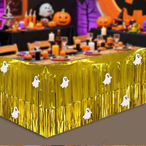 Golden foil fringe table skirt with white ghost patterns for Halloween party decor