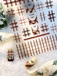 Detail of YT6460 nail stickers with brown and dark green plaid and bow patterns