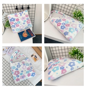 Detail view of plush floral tote bag with soft faux fur texture and large capacity design