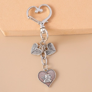Silver angel wing heart keychain with rhinestone accents and heart clip hook