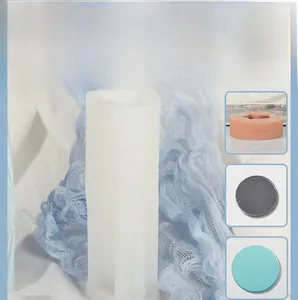 Detail showing the tall rectangular white silicone mold with three colorful wax disk samples