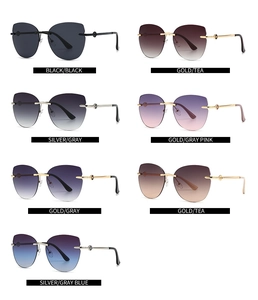 Grid display of seven colorful rimless cat eye sunglasses with metal temple details