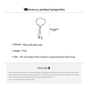 Detail showing tiered fringe pendant necklace with acrylic beads and alloy charms